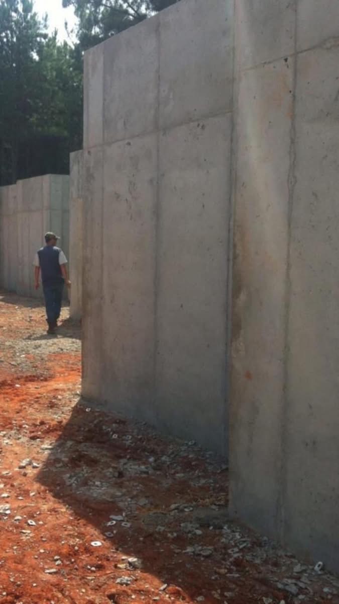 Tall poured concrete foundation wall showing height