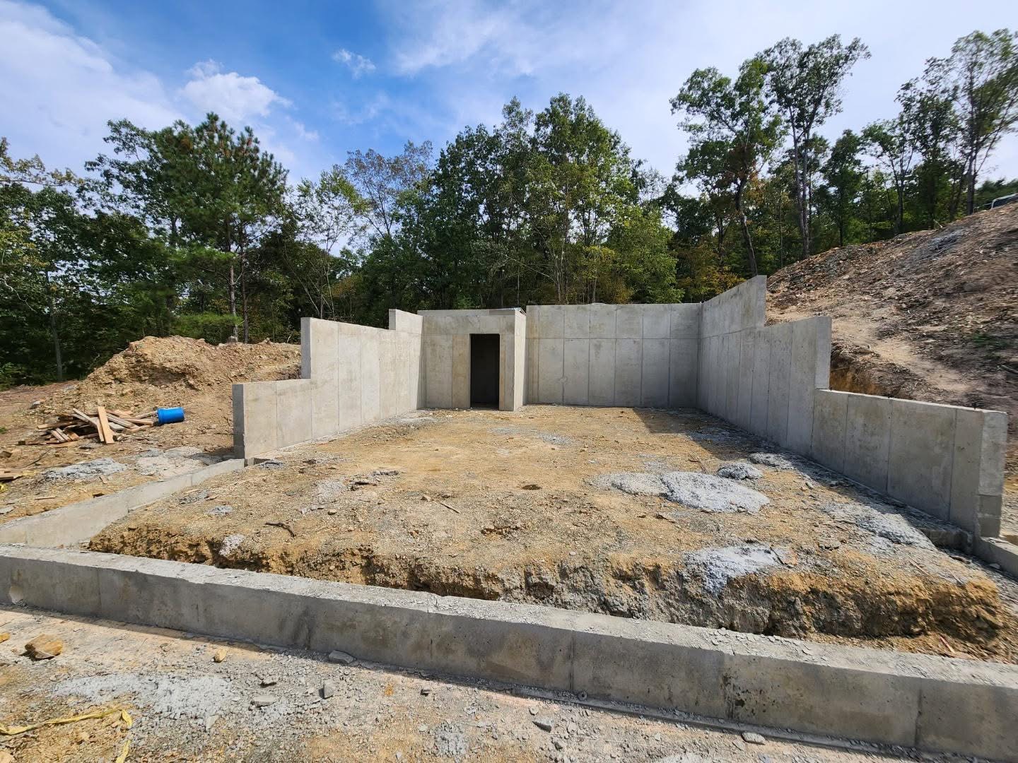 Walkout basement foundation in wooded Alabama terrain