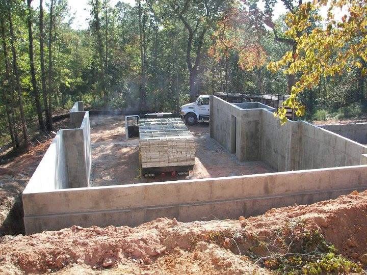 Foundation pour with Alabama Poured Walls truck on site